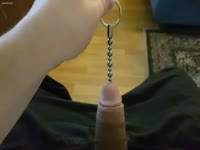 Man putting chains on his cock